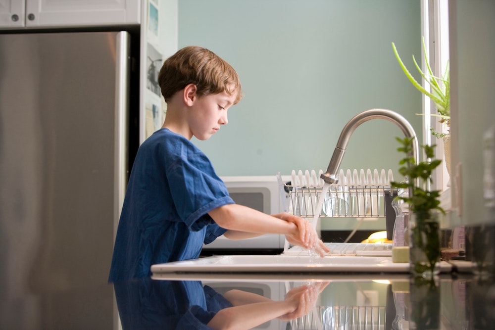 boy washing hands to Prevent Respiratory Illnesses